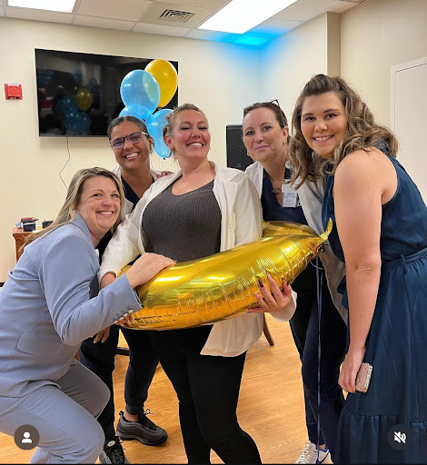 A joyful gathering with friends, celebrating with balloons and a fun golden banana!