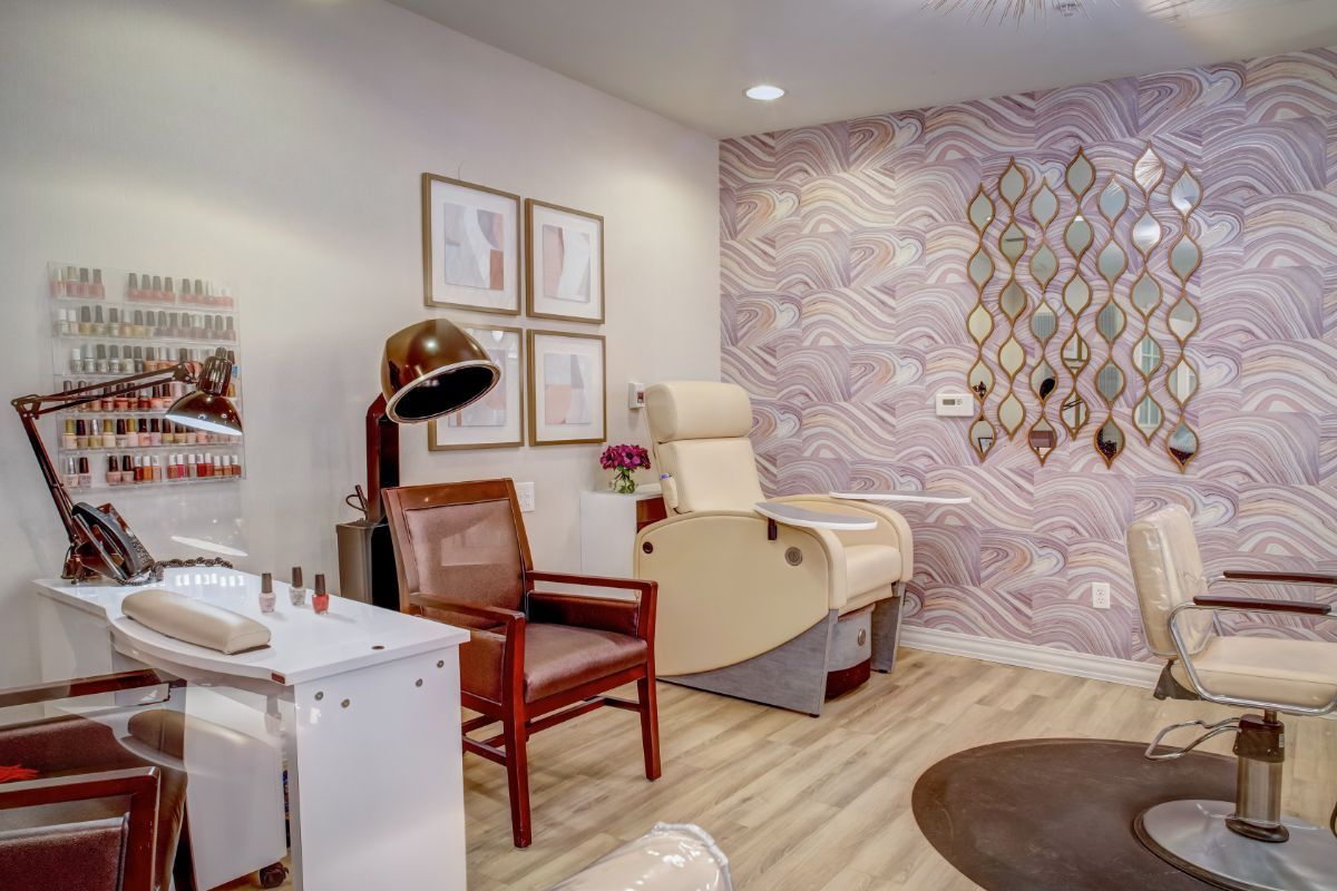 A modern salon interior featuring stylish decor and comfortable seating.