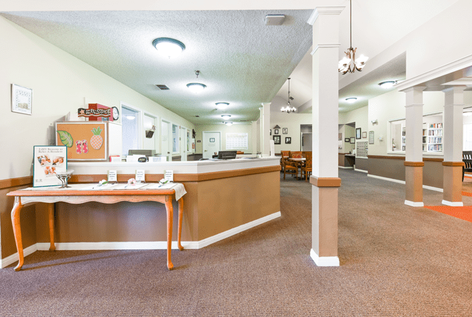 A spacious lobby and reception area with comfortable seating and modern lighting.