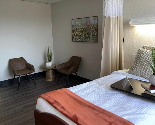 A stylish hotel room featuring modern furniture and a cozy ambiance.