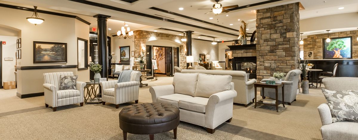 A spacious and elegantly designed living room with comfortable seating and tasteful decor.