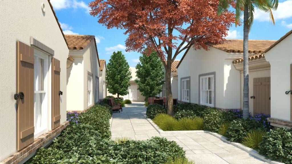 A picturesque garden pathway lined with trees and quaint houses.