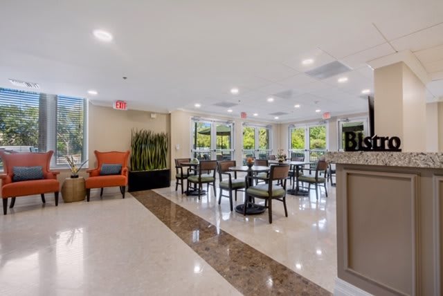 A modern dining area with ample seating and bright lighting.