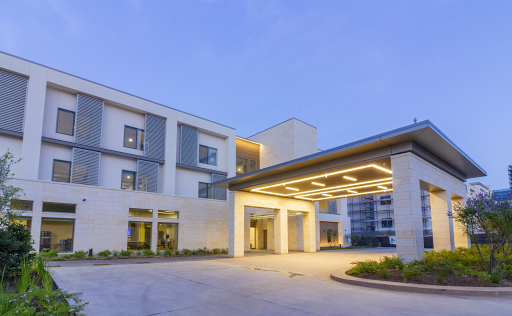 A modern building showcasing a stylish entrance and contemporary architectural design.