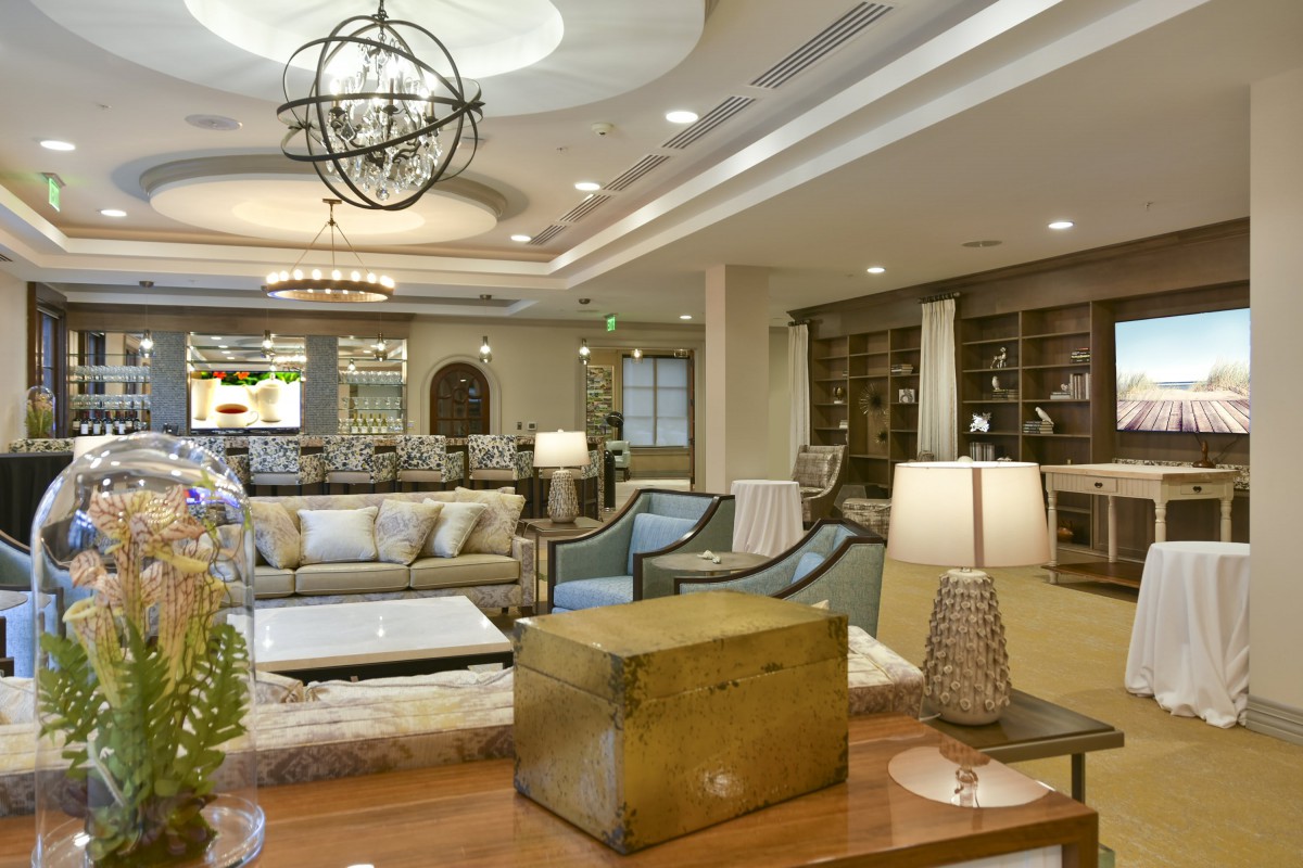 A modern living room featuring comfortable sofas, stylish lighting, and a well-organized sitting area.
