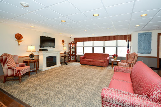 A cozy living room featuring a fireplace and comfortable seating.