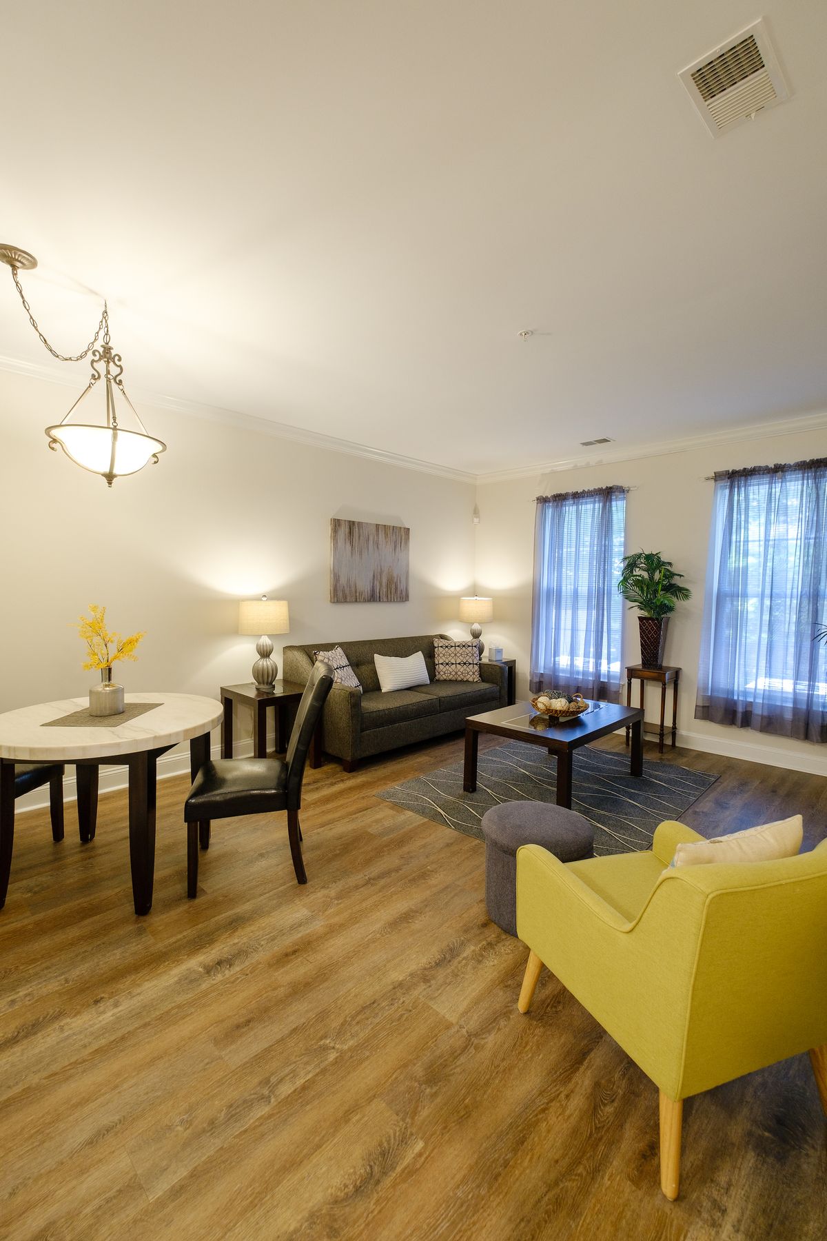 A cozy living room with modern furniture and warm lighting.