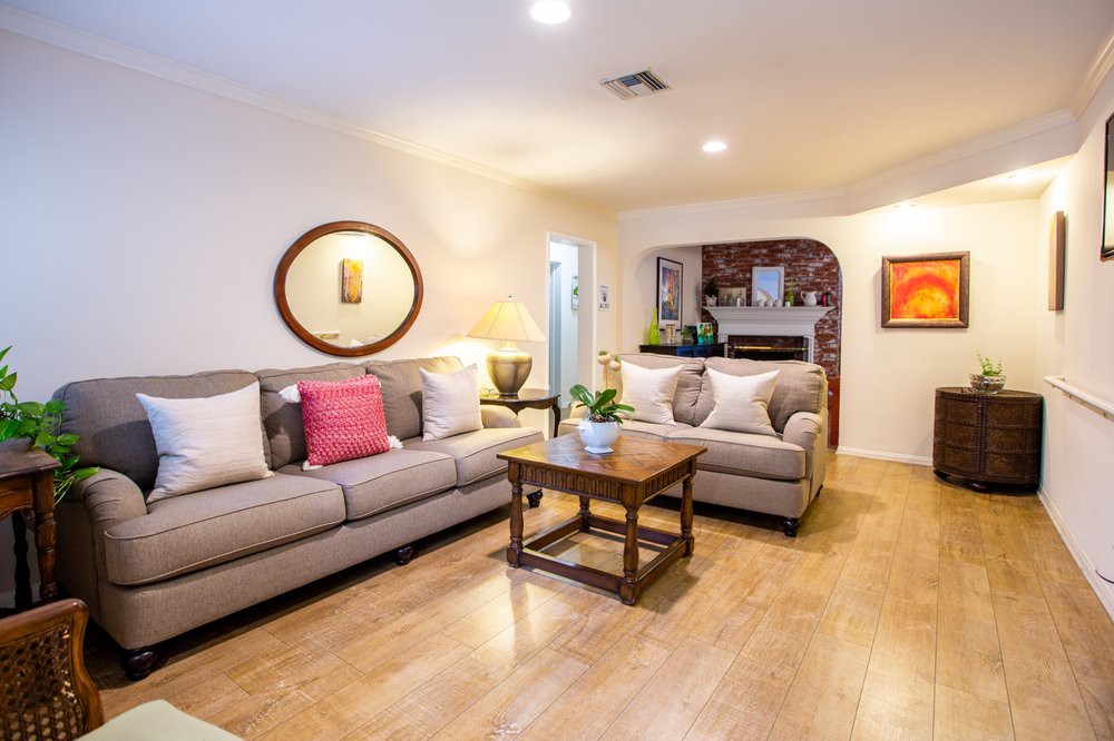 A cozy living room with comfortable sofas, a wooden coffee table, and stylish decor.