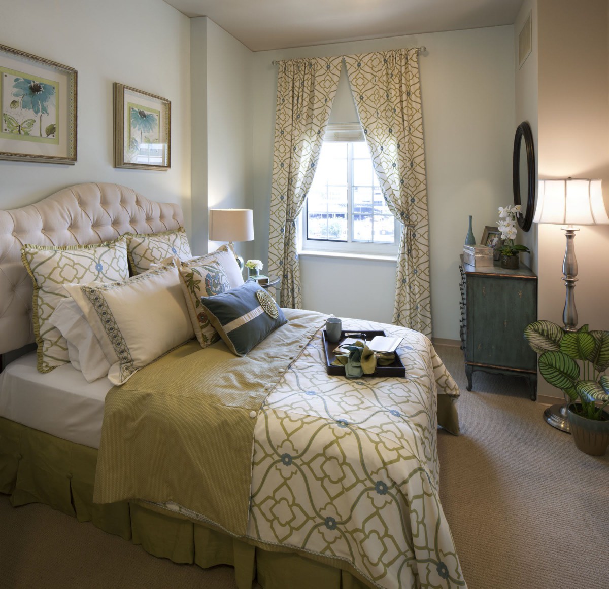 A cozy and elegantly decorated bedroom with stylish furnishings and soft lighting.