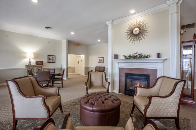 A cozy living room with comfortable seating and a fireplace.