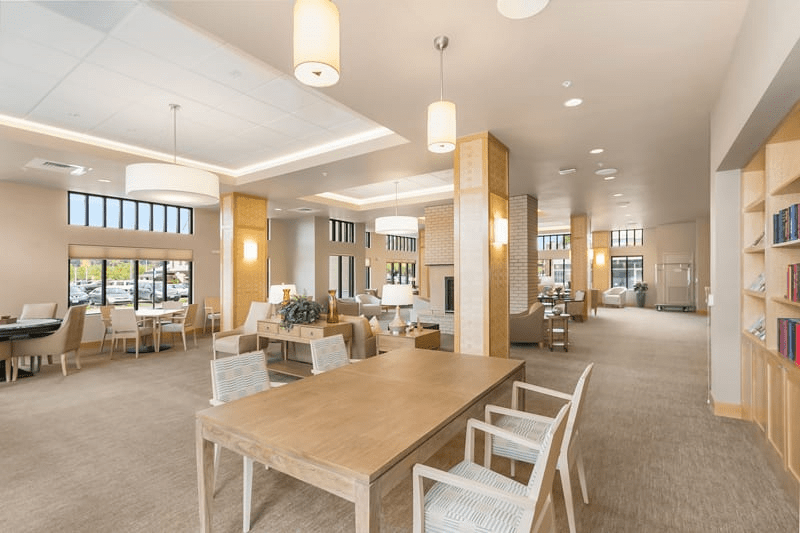 A spacious and modern interior with ample seating and warm lighting.