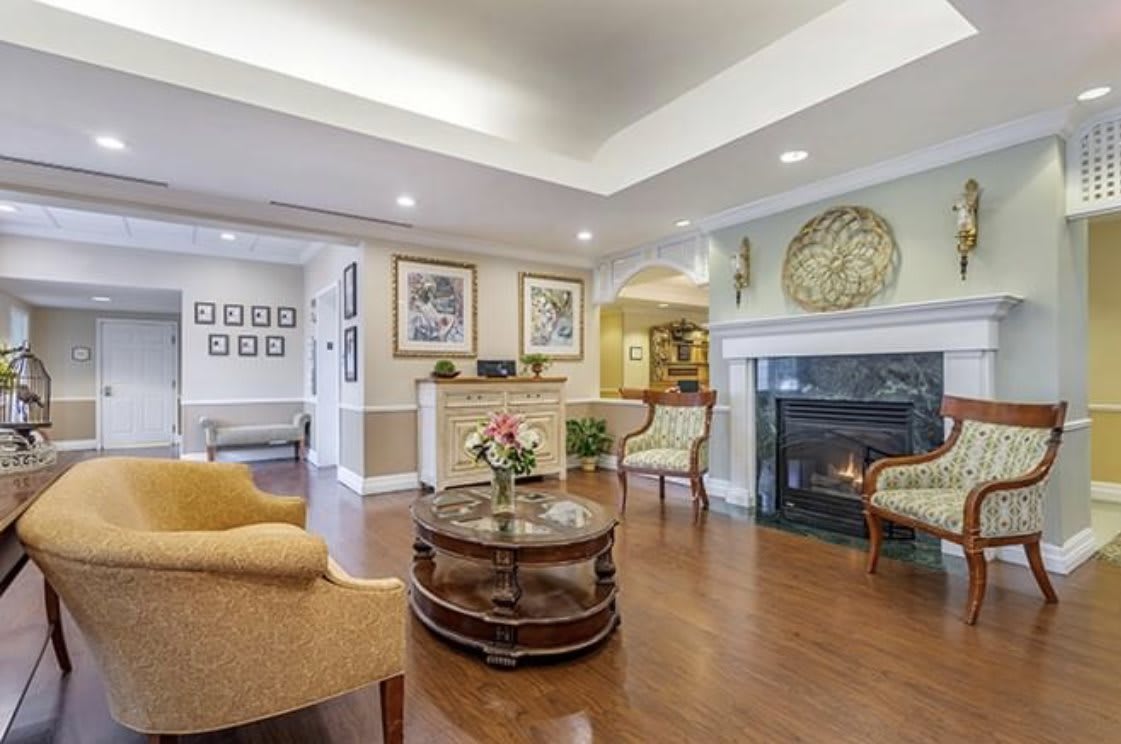 A cozy living room with elegant decor and a fireplace.