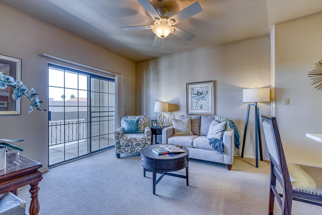 A cozy living room with comfortable seating and ample natural light.