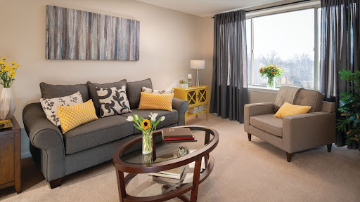 A cozy living room featuring modern furniture and a warm color palette.