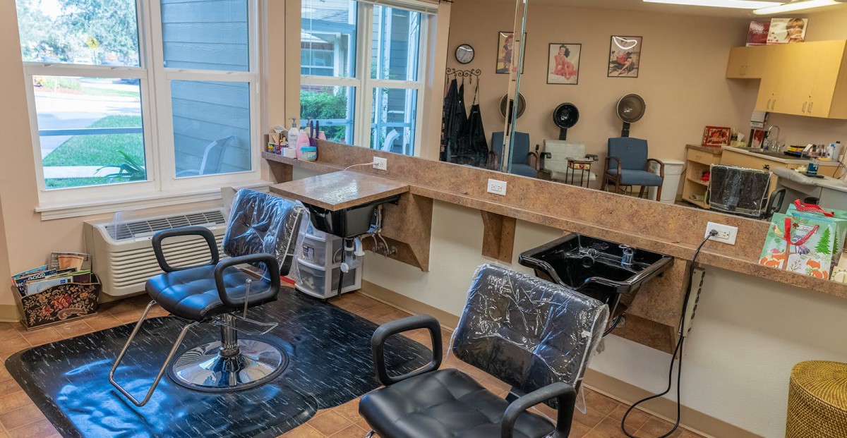 A well-organized hair salon with styling chairs and mirrors.