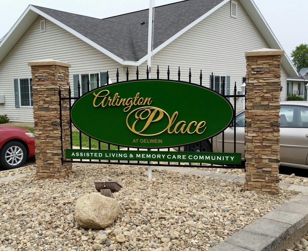 Entrance sign for Arlington Place, an assisted living and memory care community.