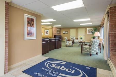 A welcoming reception area of Saber Healthcare Group, featuring comfortable seating and a professional ambiance.