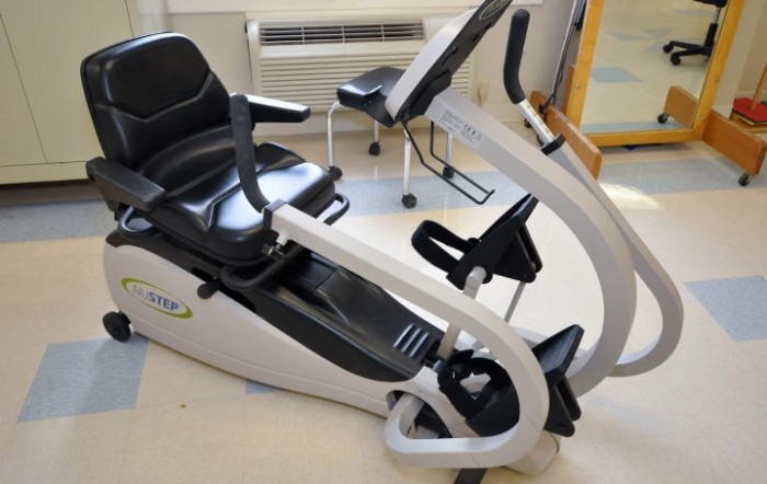 A recumbent exercise bike in a fitness room.