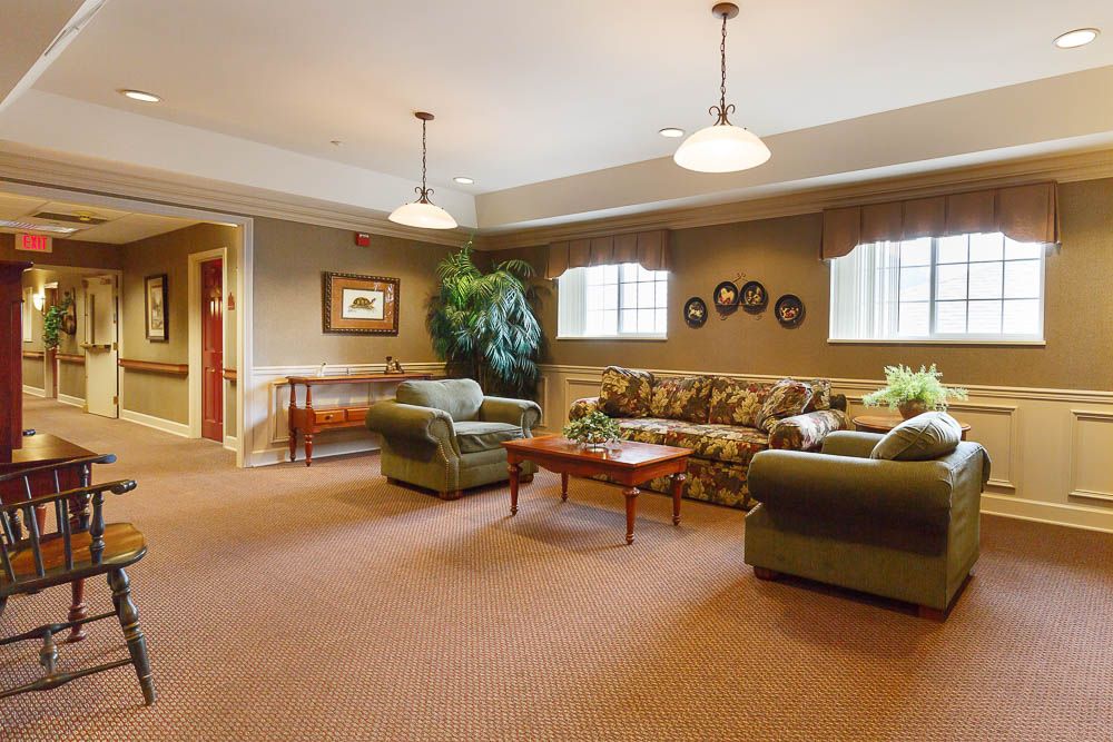 A cozy living room with comfortable seating and warm lighting.