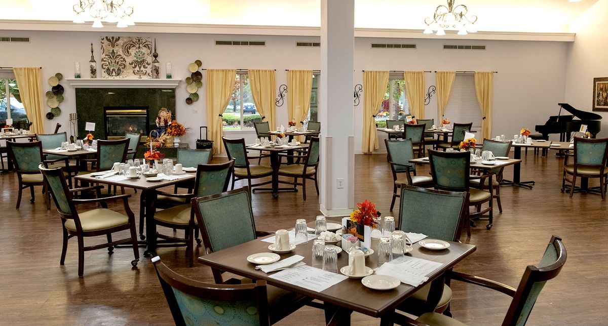 An elegant dining area with neatly arranged tables and chairs, perfect for a cozy meal.