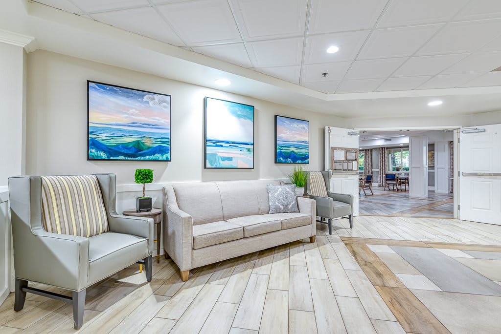A modern lobby with comfortable seating and vibrant artwork.