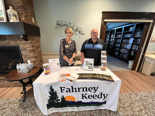 Representatives at the Fahrney Keedy information booth during a community event.