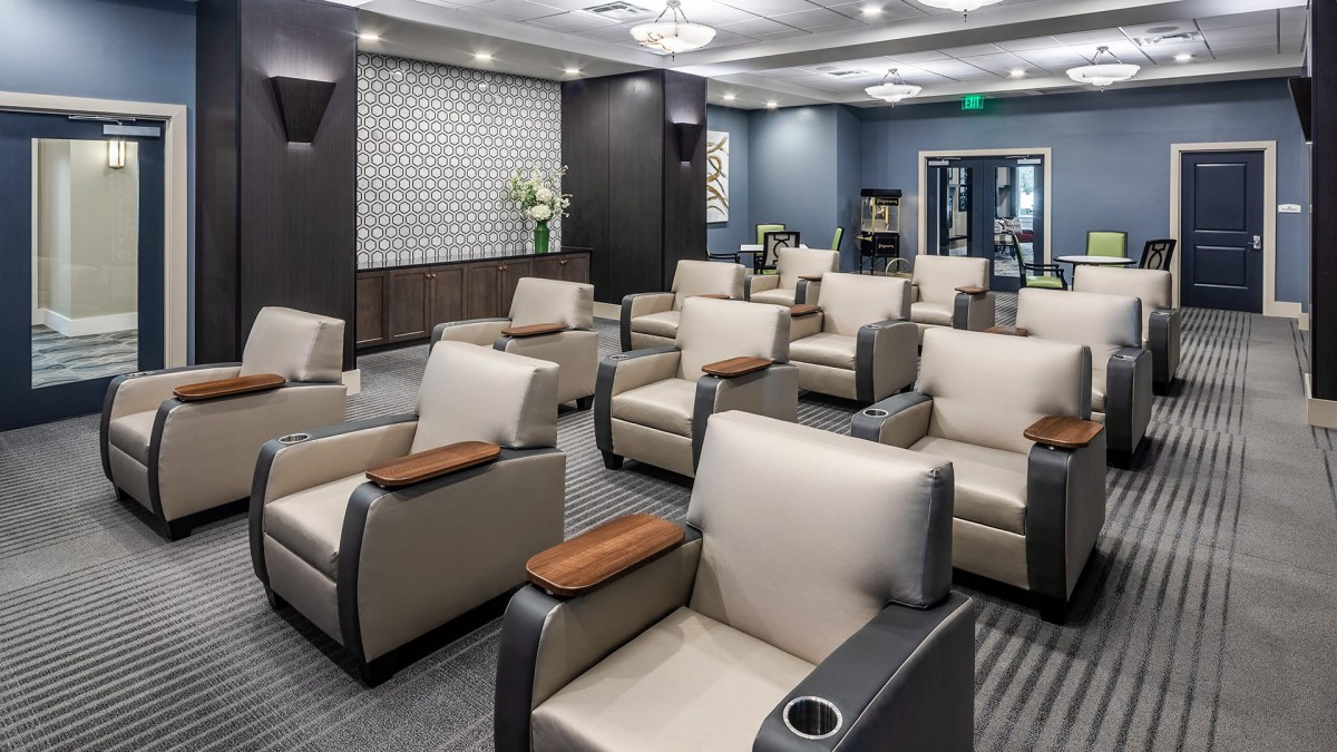 A modern waiting room with arranged seating and elegant decor.