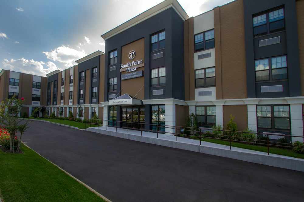 Exterior view of a modern hotel building with a welcoming entrance.