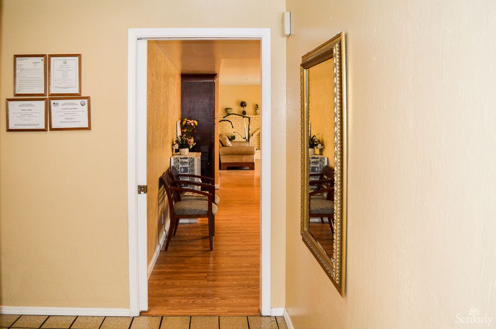 A view through a doorway into a cozy living room, featuring elegant furniture and decor.