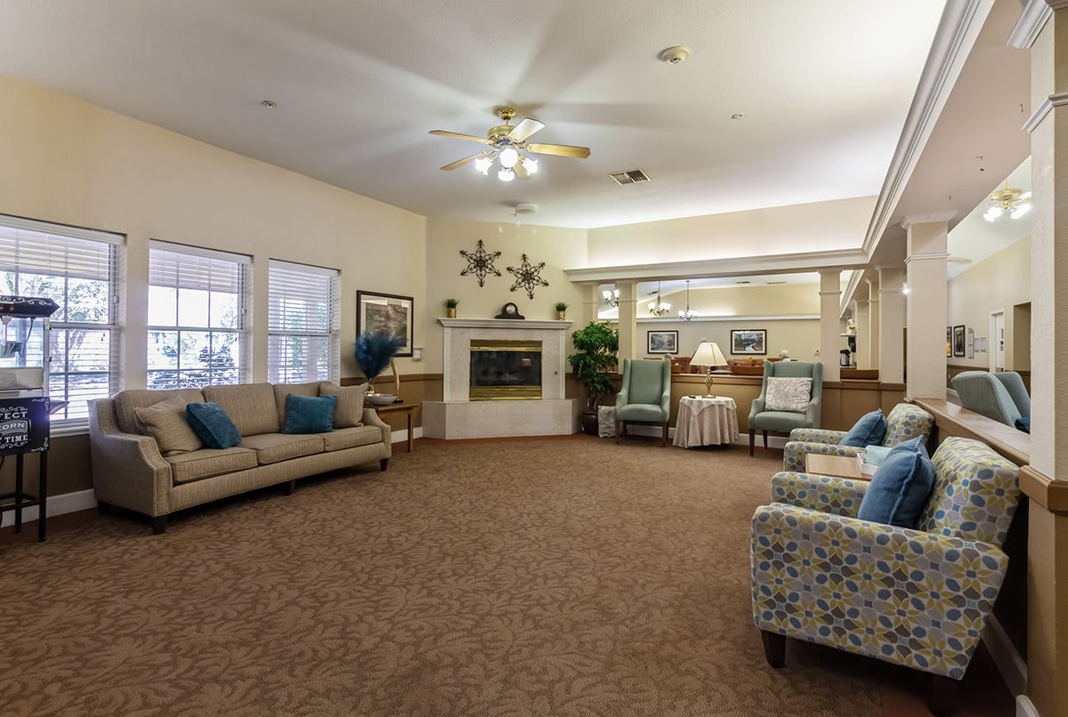 A cozy living room interior with comfortable seating and a fireplace.