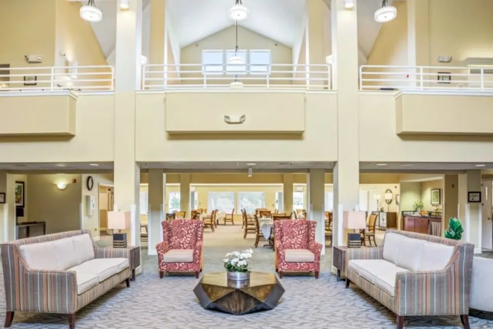 A spacious and bright living room with comfortable seating and elegant decor.