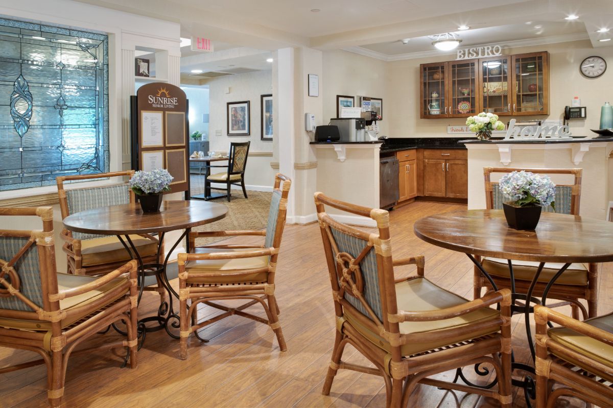 A cozy dining and kitchen area with wooden furniture and decor.