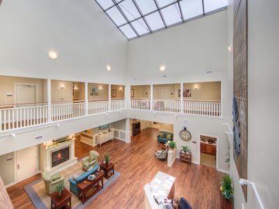 A spacious atrium with cozy seating and a skylight.
