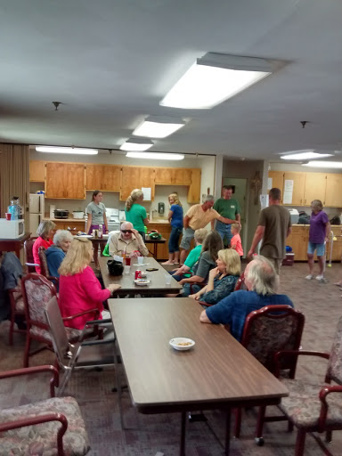 A vibrant community gathering in a shared kitchen space.