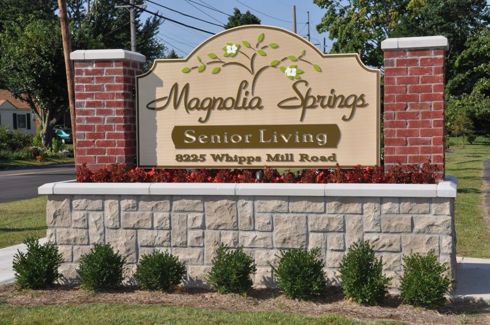 Entrance sign for Magnolia Springs Senior Living at 8225 Whipps Mill Road.