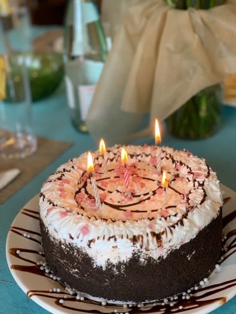 A delicious birthday cake adorned with lit candles, ready for celebration.
