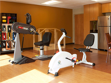 A fitness area featuring exercise bikes and other gym equipment.