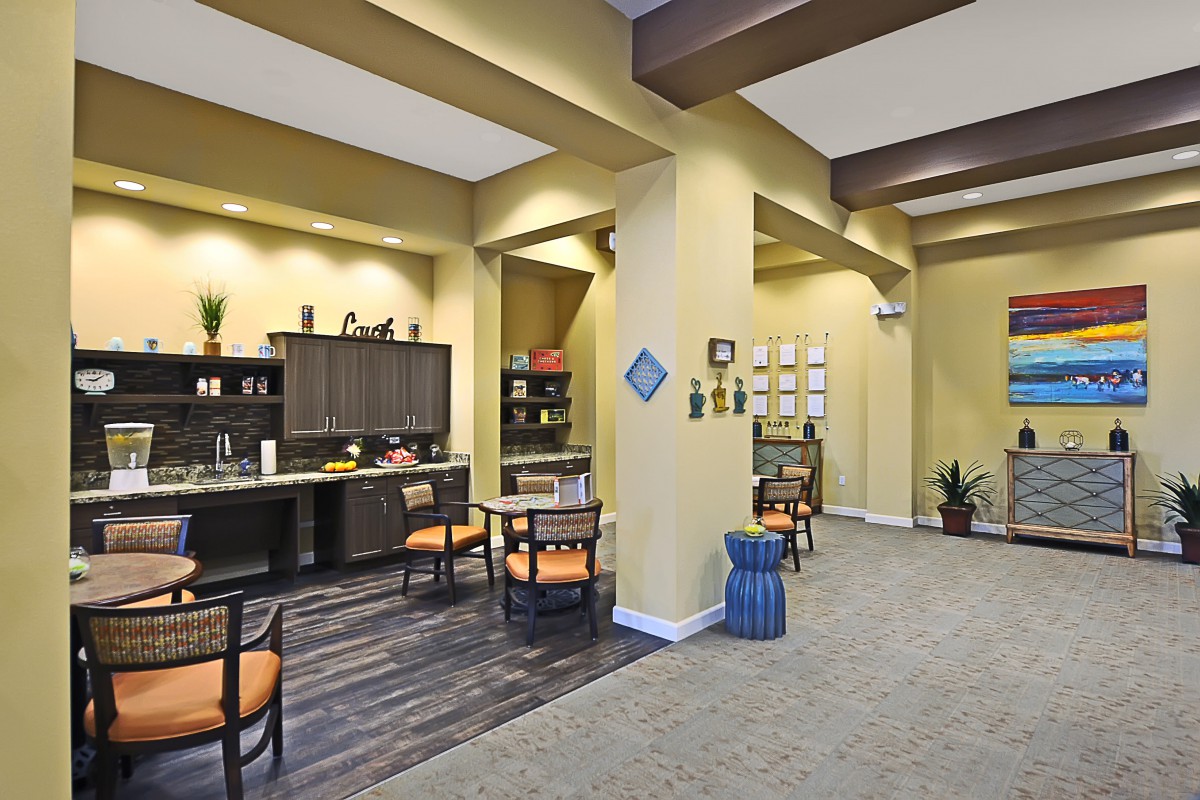A modern and cozy lounge area with seating and decorative elements.