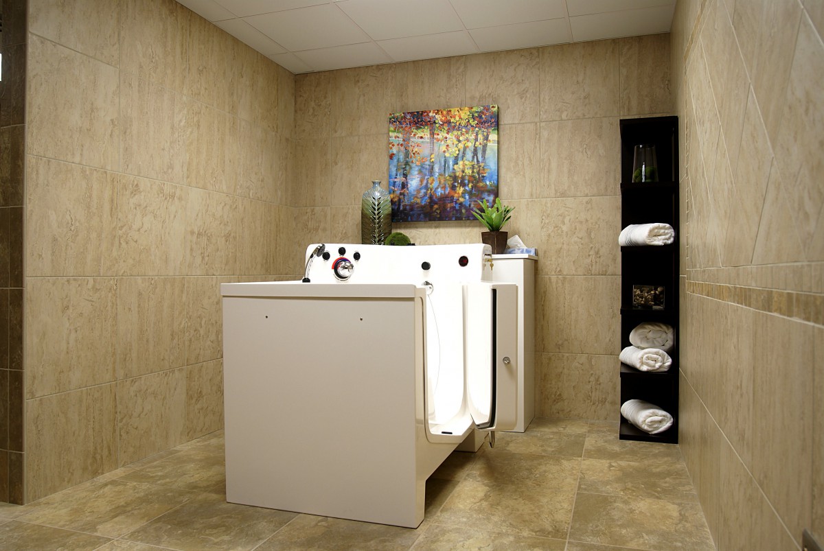 A modern bathroom featuring a walk-in bathtub designed for safety and accessibility.