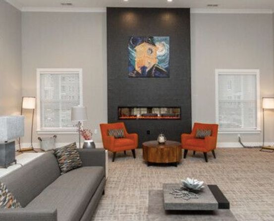 Modern living room with stylish furniture and artwork.