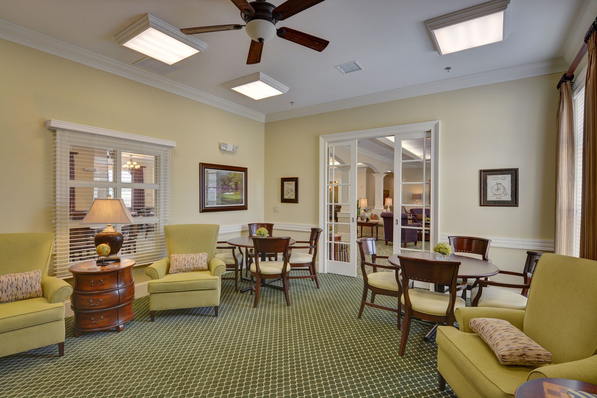 A cozy living room featuring comfortable seating and elegant decor.