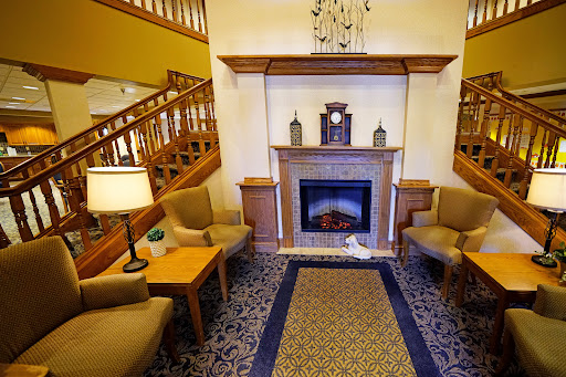 A cozy living room featuring a fireplace and comfortable seating, perfect for relaxation.