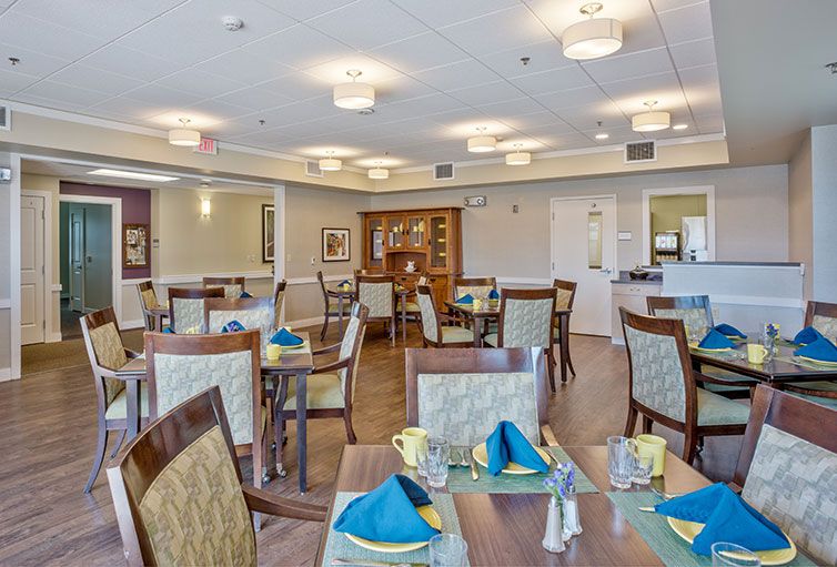 A neatly arranged dining room with tables set for service.