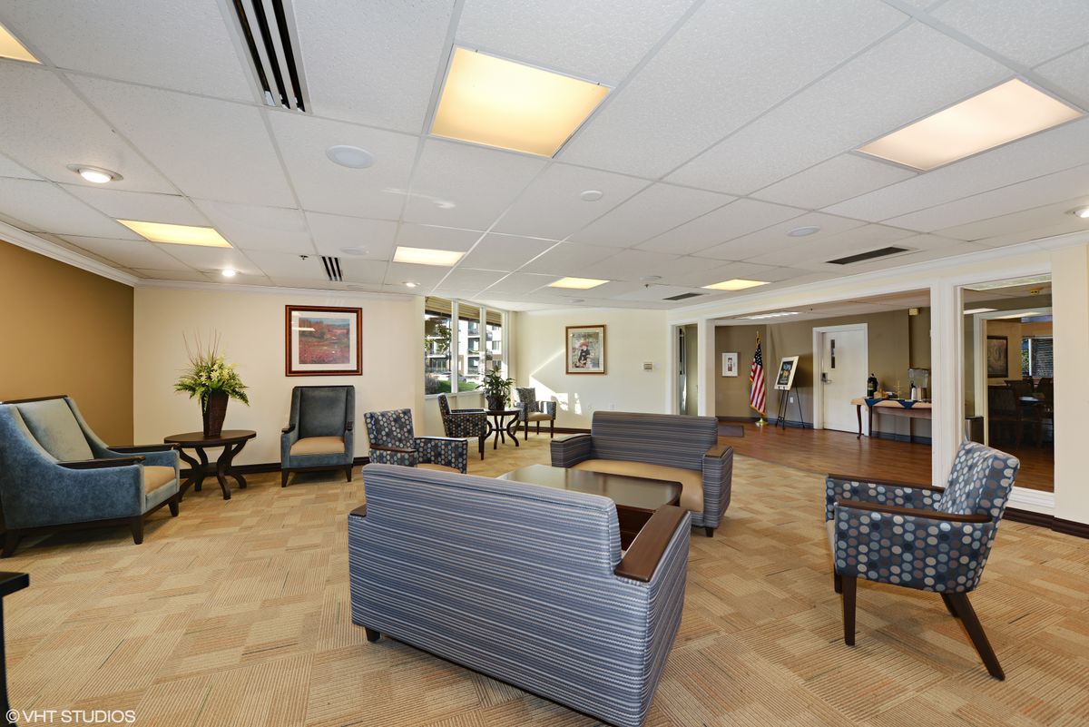 A well-lit lobby area with comfortable seating and tasteful decor.