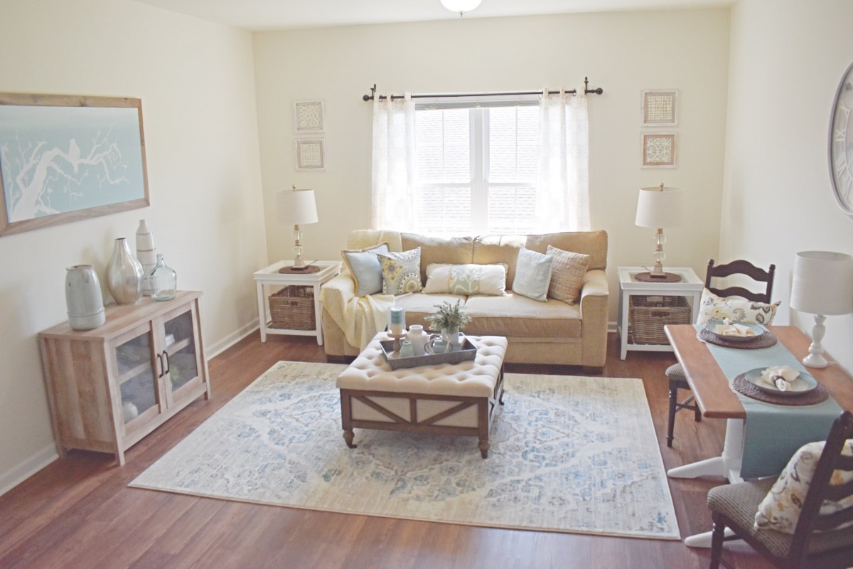 A cozy and bright living room with a neutral color palette and stylish decor.