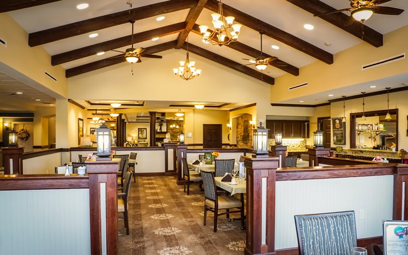 A cozy restaurant interior with elegant lighting and well-arranged seating.