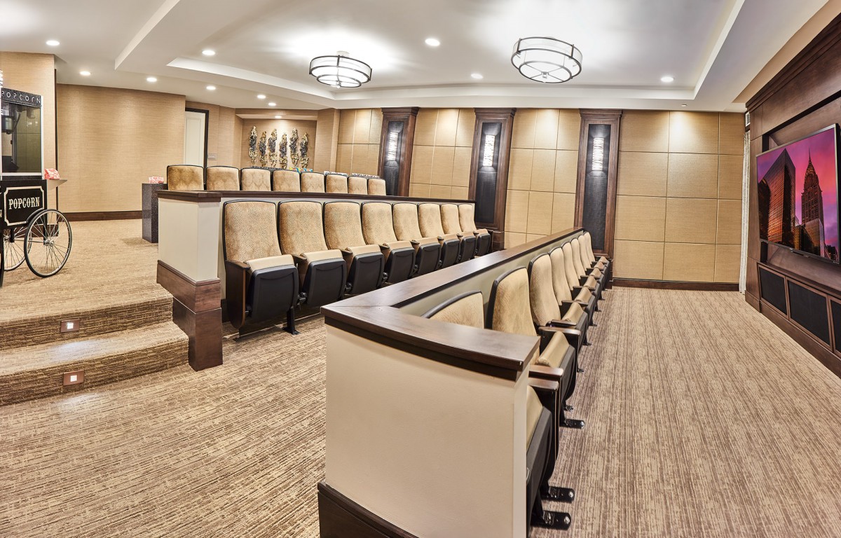 A modern conference room with theater-style seating and contemporary design.