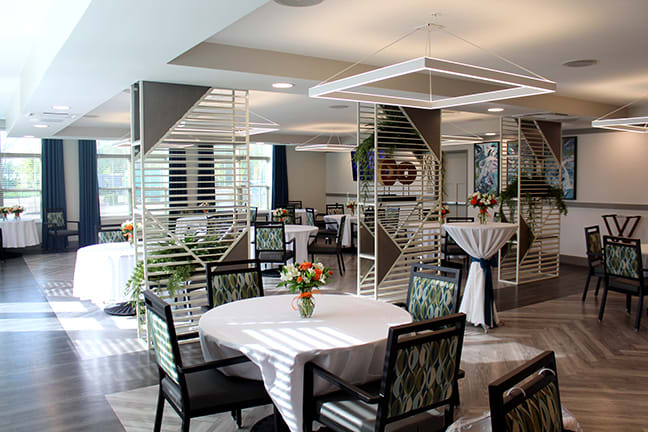 A modern dining area with elegantly set tables and contemporary decor.