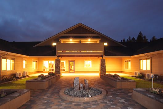 A well-lit building exterior at night.