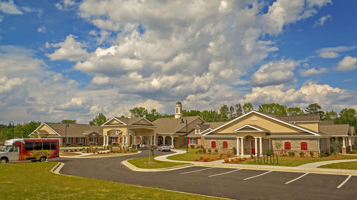 A picturesque view of a residential building under a cloudy sky.